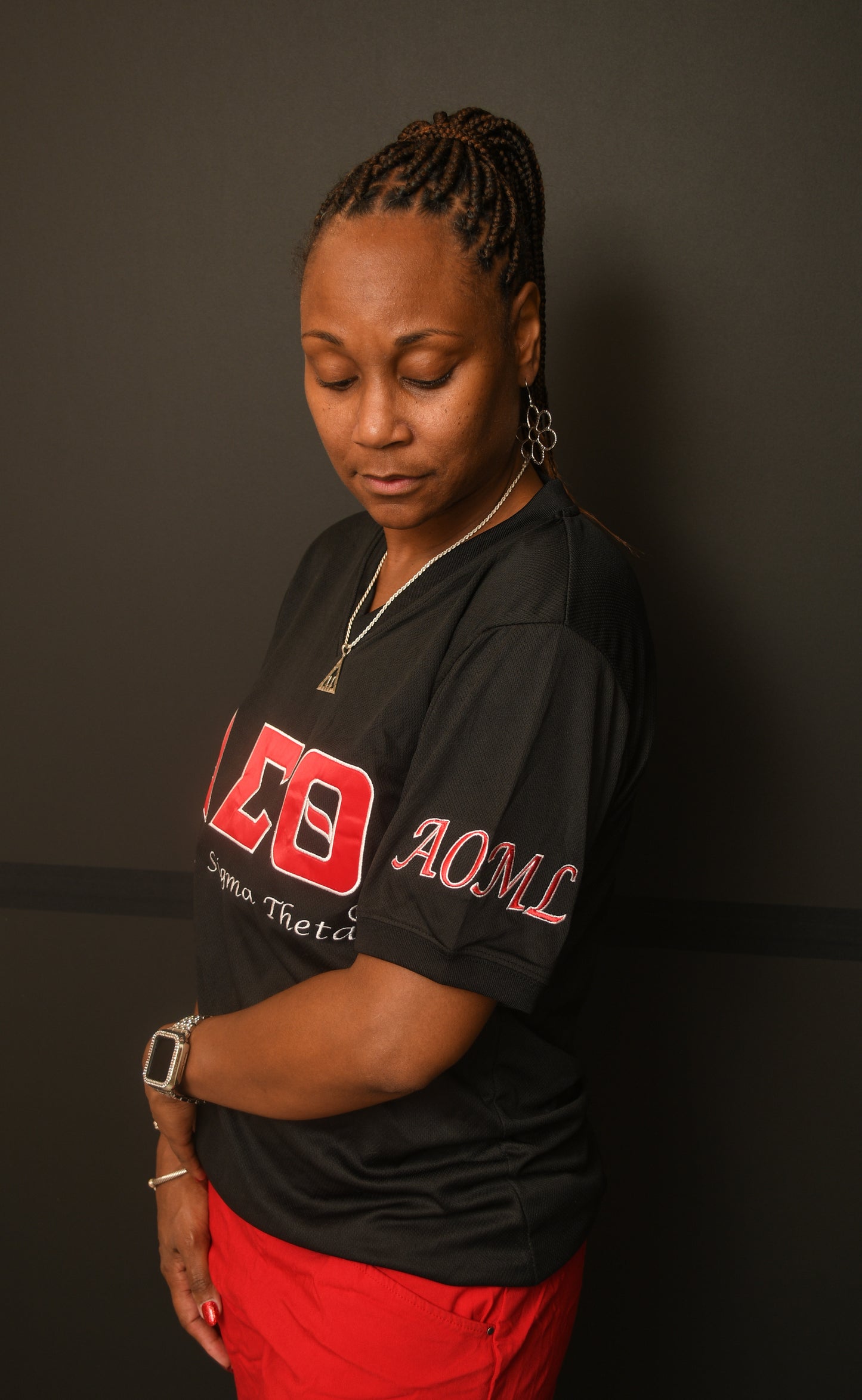 black women's v neck t-shirt with DST symbols on the front and AOML on the sleeve