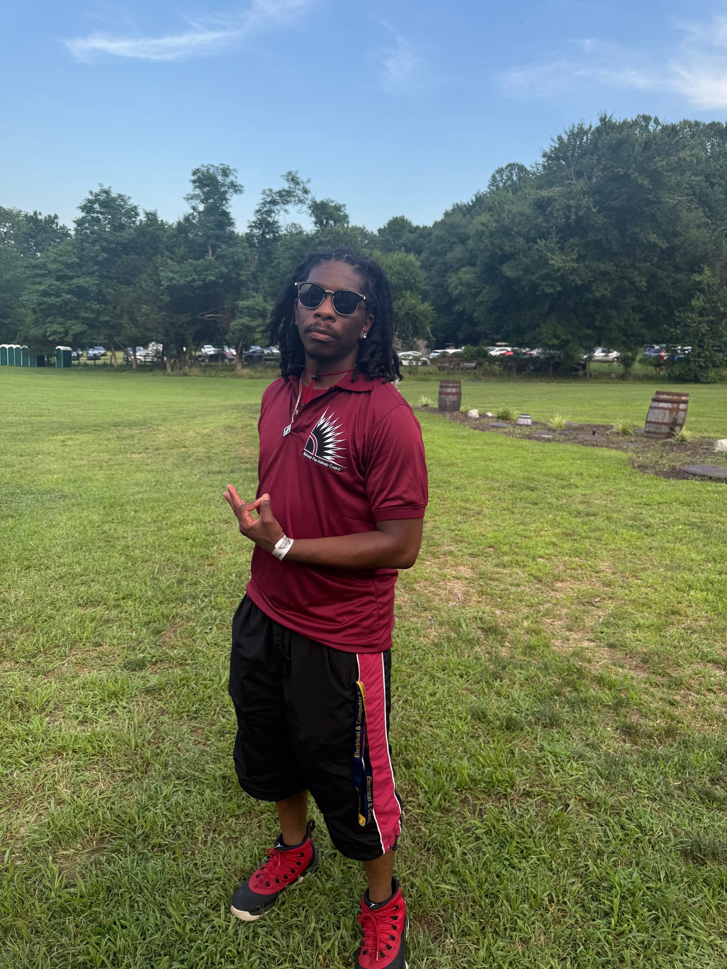 Crimson polo shirt with NPHC embroidered logo